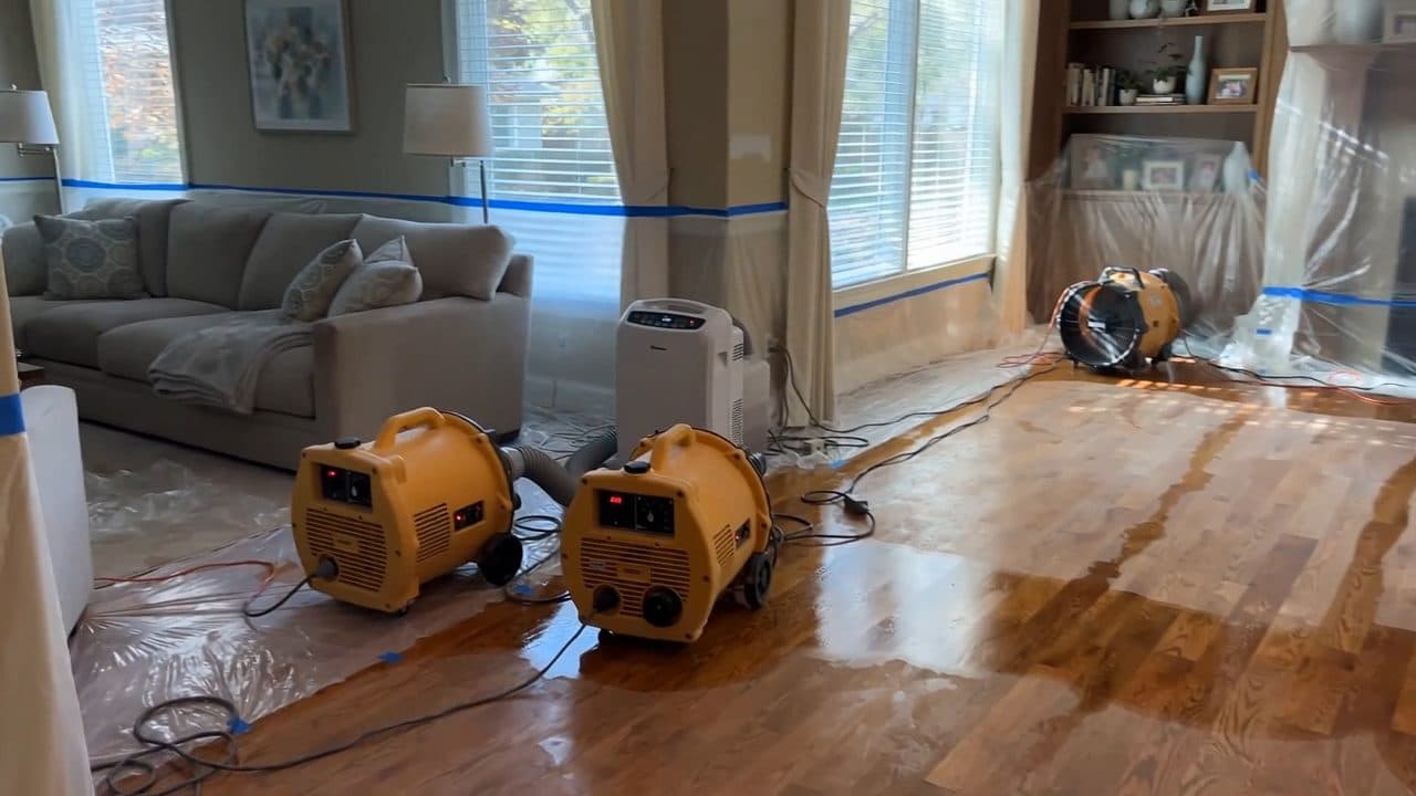 Water damage restoration equipment drying a home
